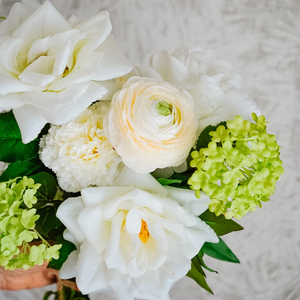 White roses, peonies and green snowball viburnum in the Alba silk bouquet