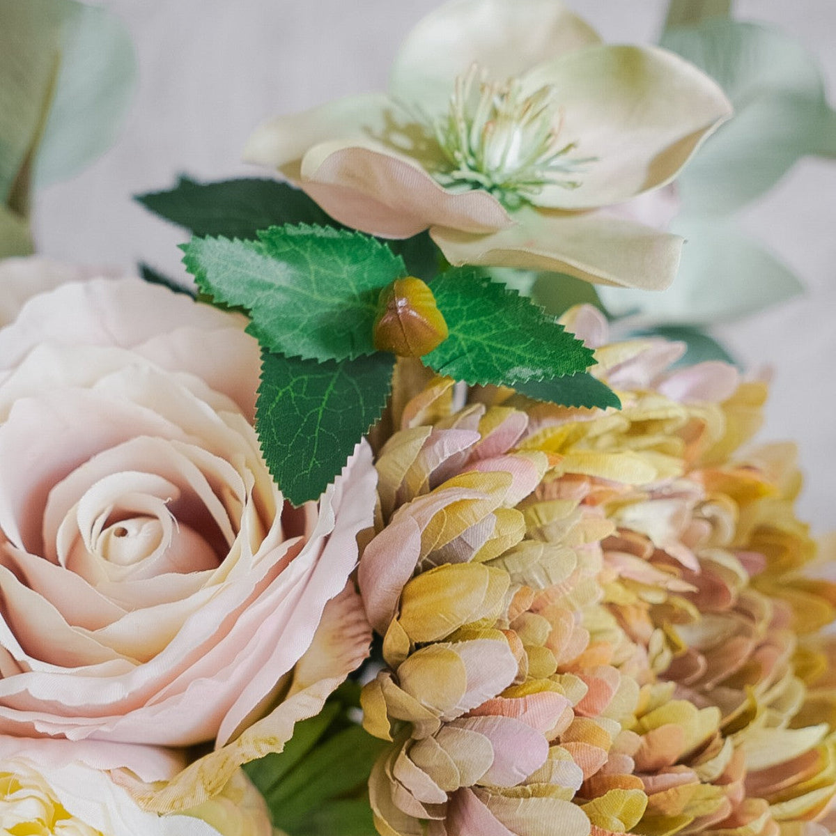Close-up of rose, ranunculus and chrysanthemum in the Camille silk bouquet