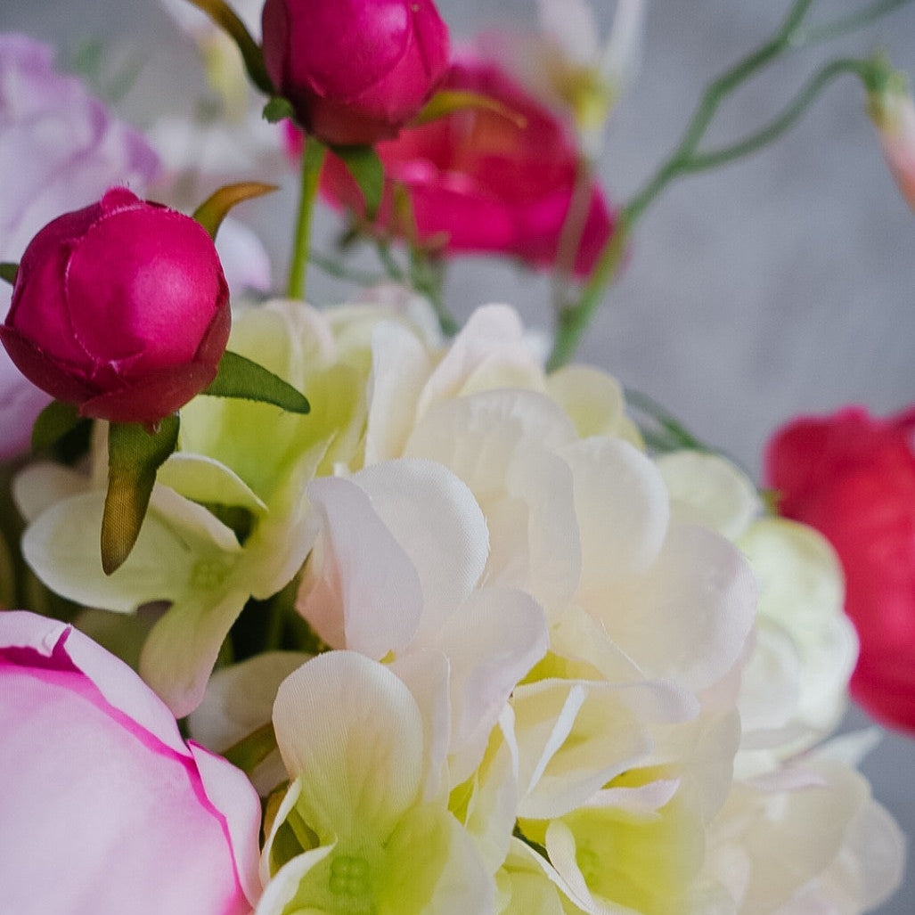Pale hydrangea and deep rose buds in the Elodie bouquet