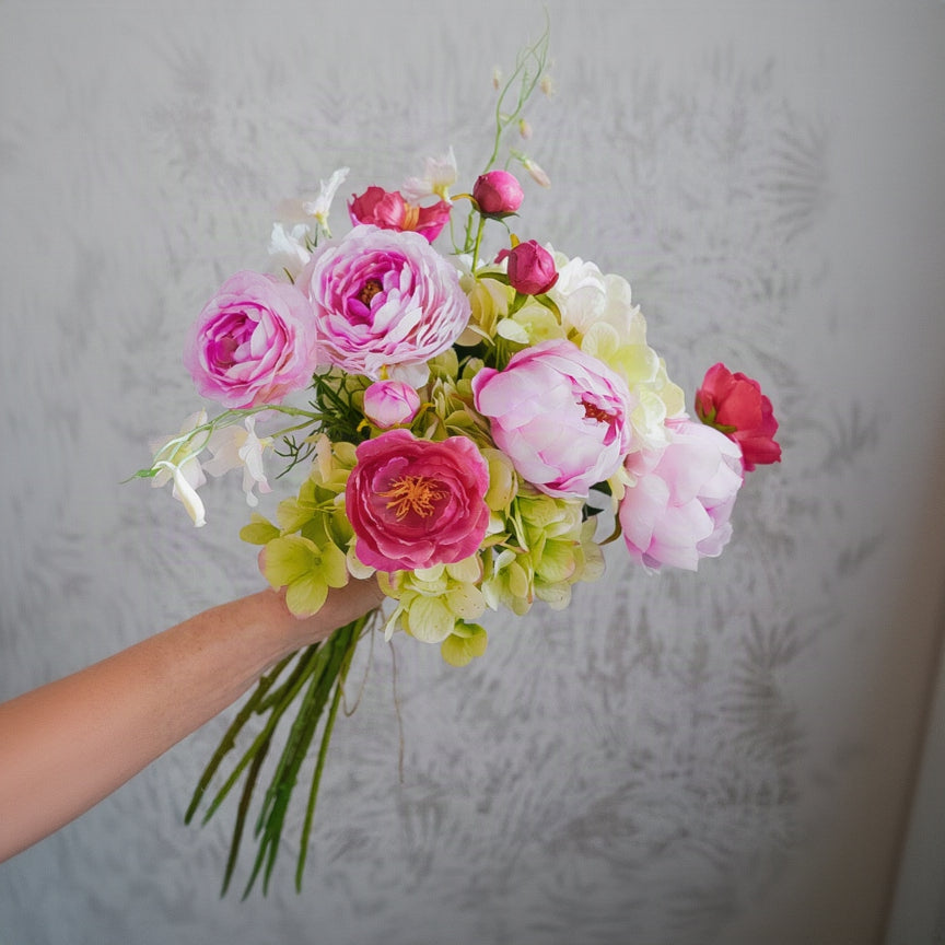 Layered Elodie silk flower bouquet held in hand