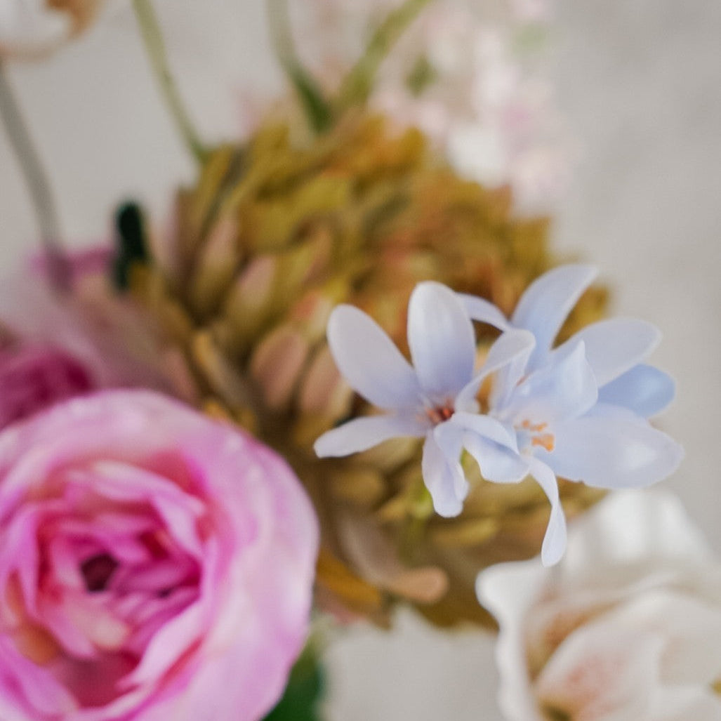 Close-up of pale blue hyacinth and pink peony in the Livia bouquet
