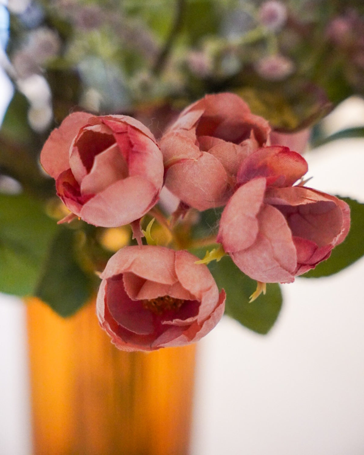 Close-up of small rose-toned blooms in the Violetta bouquet