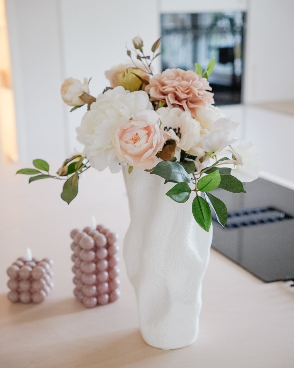 Estelle silk flower bouquet in a white vase in a light home interior