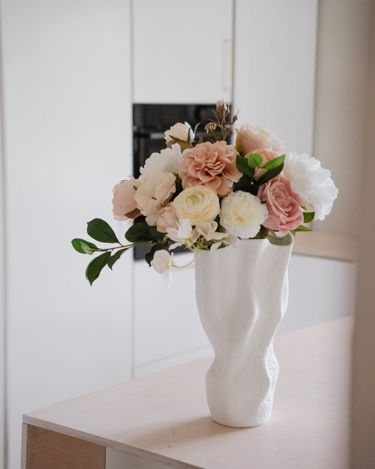 Estelle silk flower bouquet in a white vase, in dusty pink, cream and white