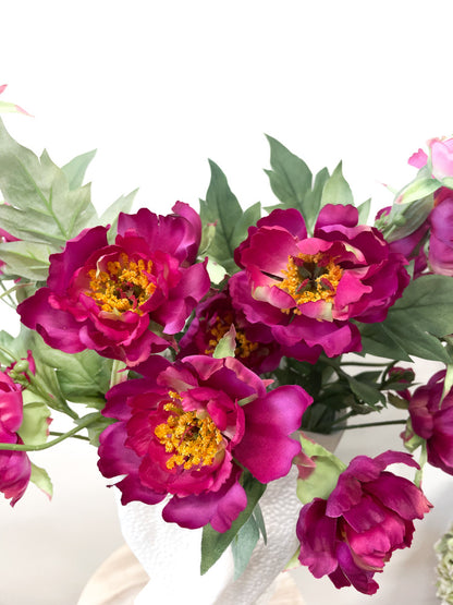 Detail of a fuchsia silk peony bloom