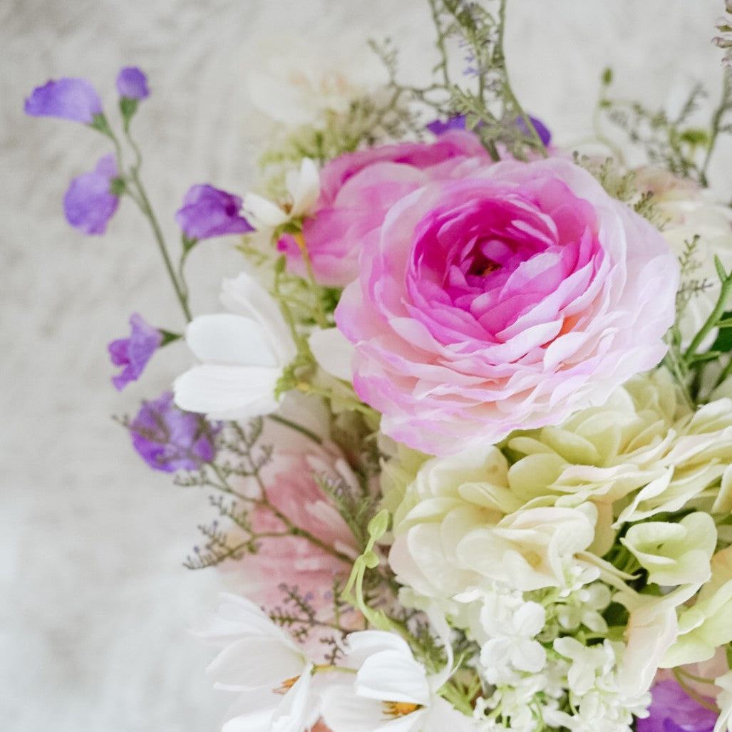 Close-up of pink and white flowers in the Isla bouquet