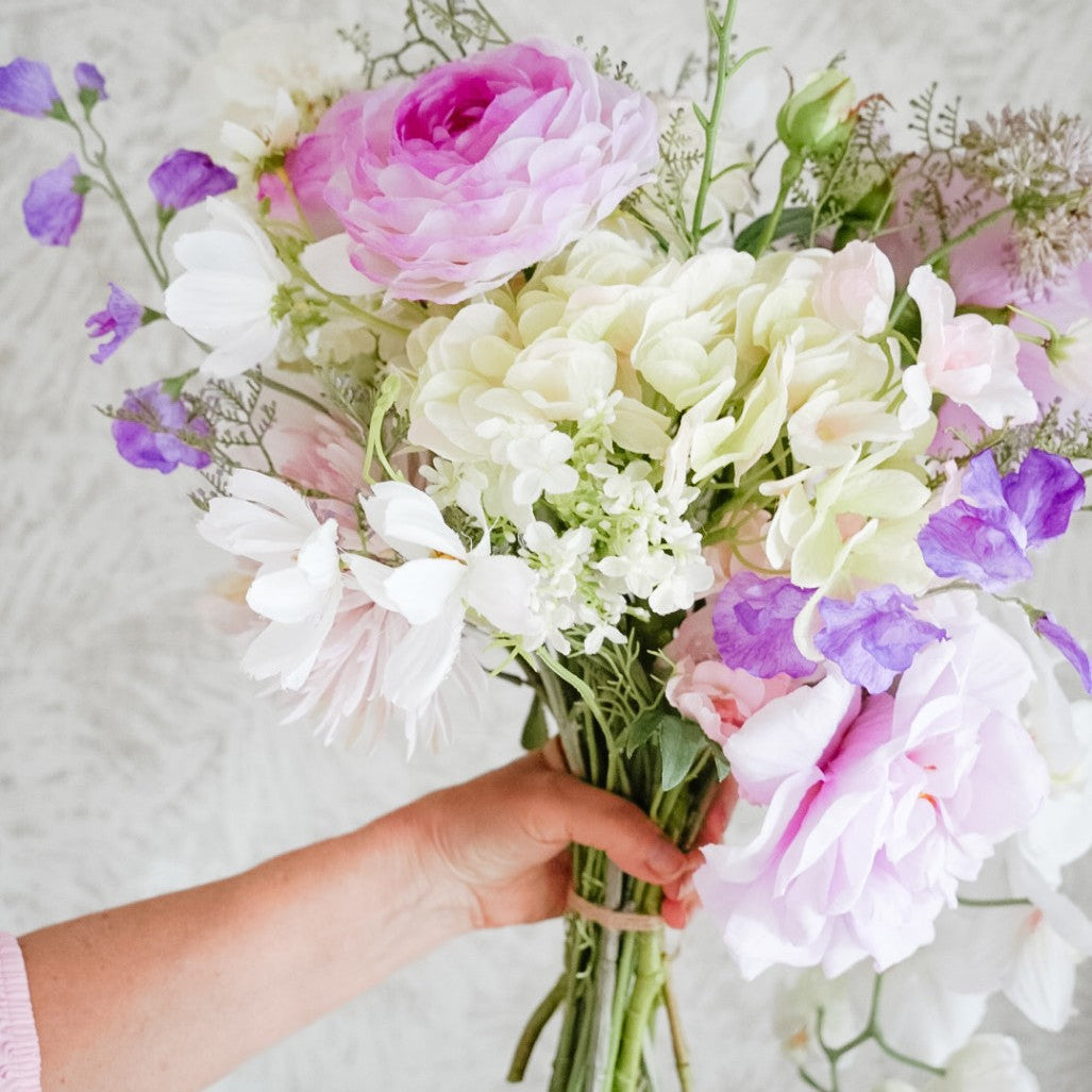 Close-up of lilac and white flowers in the Isla bouquet