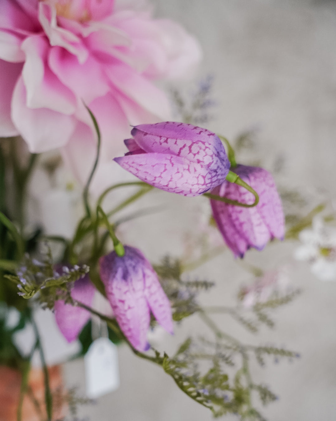 Lilac and pink blooms with green foliage in the Lilac bouquet