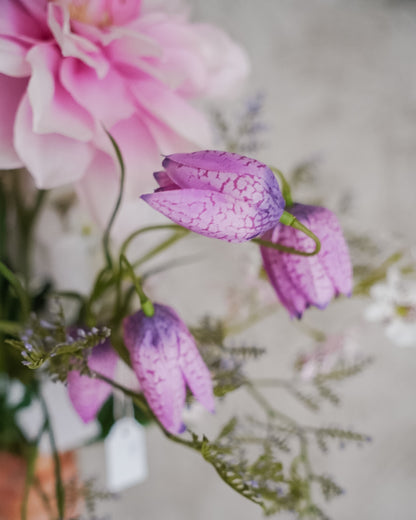 Lilac and pink blooms with green foliage in the Lilac bouquet