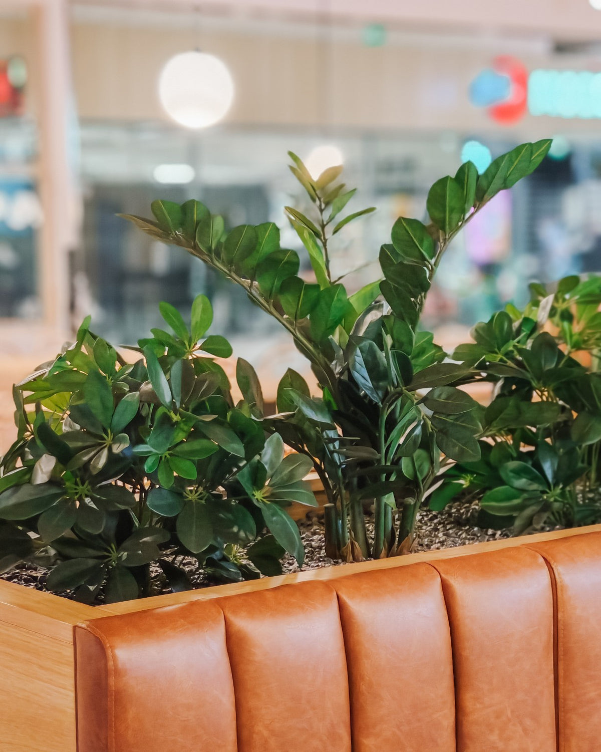 Lifelike artificial plant in a restaurant seating area
