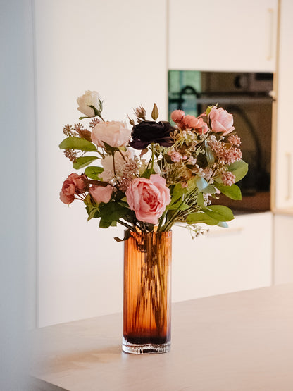 Full Violetta silk flower bouquet in a tall amber vase